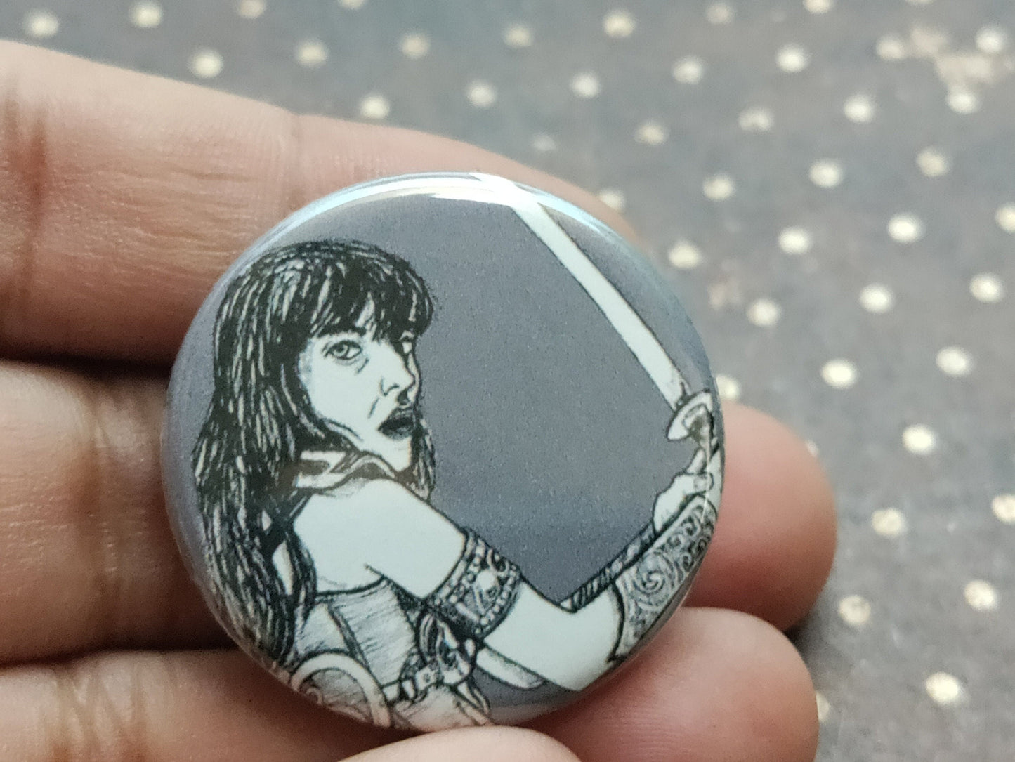 Embrace your inner warrior with our Xena Warrior Princess Pinback Button