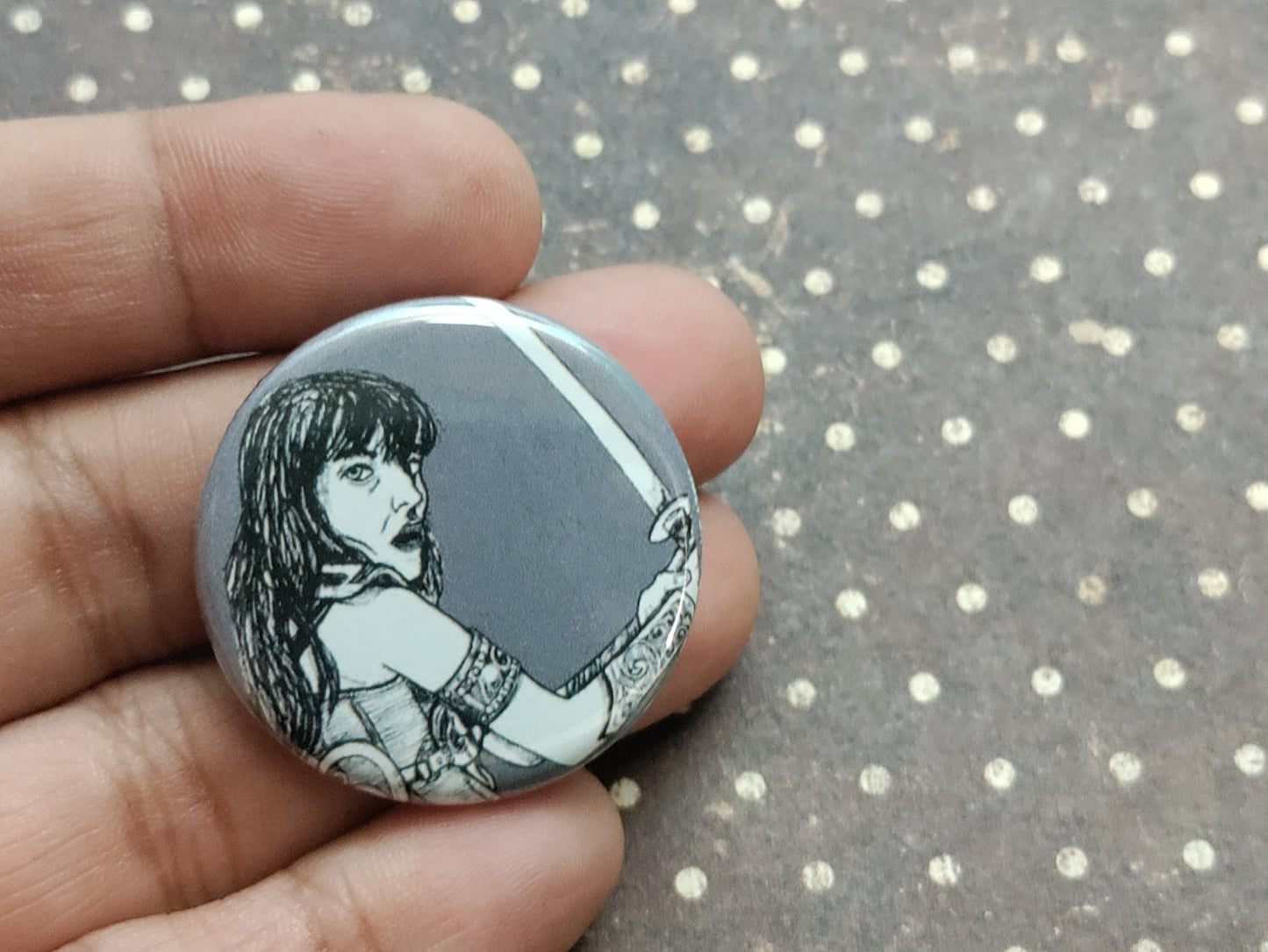 Embrace your inner warrior with our Xena Warrior Princess Pinback Button